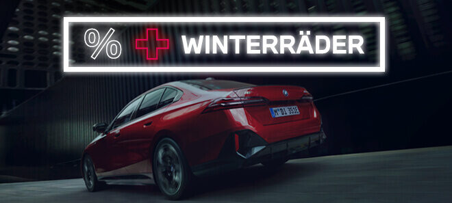 Roter BMW i4 mit Hinweis auf Black Week Winterräder-Aktion beim Autohaus Kühnert.